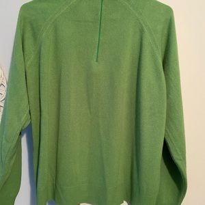 Green mock turtleneck sweater.